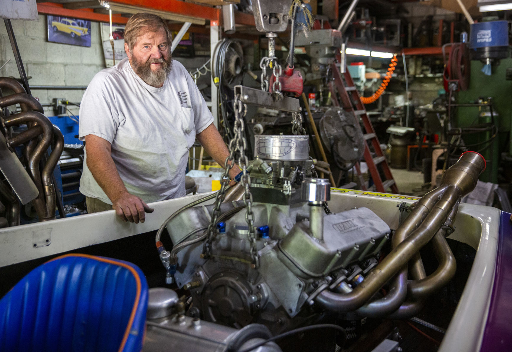 Glen Dilworth works on a racing boat